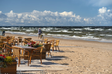 Fototapeta na wymiar Summer cafe on the beach of Jurmala in autumn