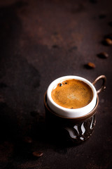 Coffee cup and beans on old kitchen table. turkish coffee and turkish delight with copyspace for your text