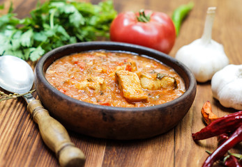 Georgian Chakhokhbili in a clay bowl