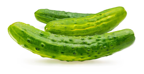 Cucumbers, whole, raw and fresh with drops of water. Isolated on white background