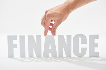 cropped view of man holding a letter on finance inscription on white background