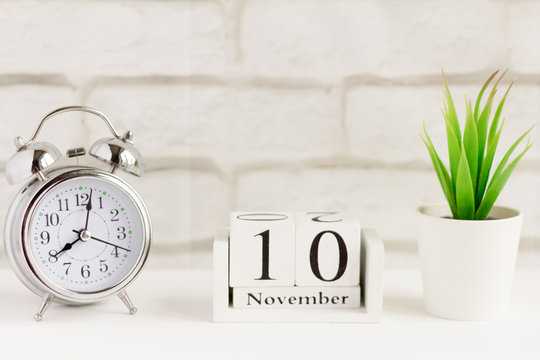 November 10 on the wooden calendar next to the alarm clock, the date of the autumn month