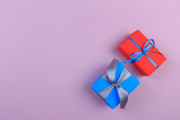 Different colored gift box on color background. Top view of various present boxes on minimal background. Birthday, Christmas, wedding, valentine, romantic gifts - Image
