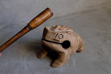 wooden croaking frog with stick