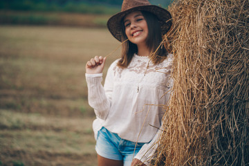 Teen girl hay. Dream. Meadow. Little girl. Nature. Portrait. 