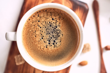 cup of fresh espresso on table, view from above