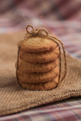 Round sweet cookies. Delicious dessert with high sugar and carbohydrate suitable for eating with milk and tea or coffee on color and white background  with red heart for Saint Valentine's Day