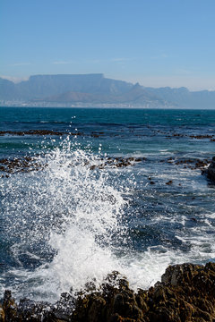 splashing sea in front of table mountain