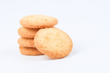 Round sweet cookies. Delicious dessert with high sugar and carbohydrate suitable for eating with milk and tea or coffee on color and white background with colorful placemat