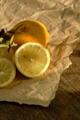 A group of lemons lies on kraft paper.