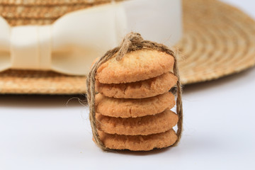 Round sweet cookies. Delicious dessert with high sugar and carbohydrate suitable for eating with milk and tea or coffee on color and white background with colorful placemat