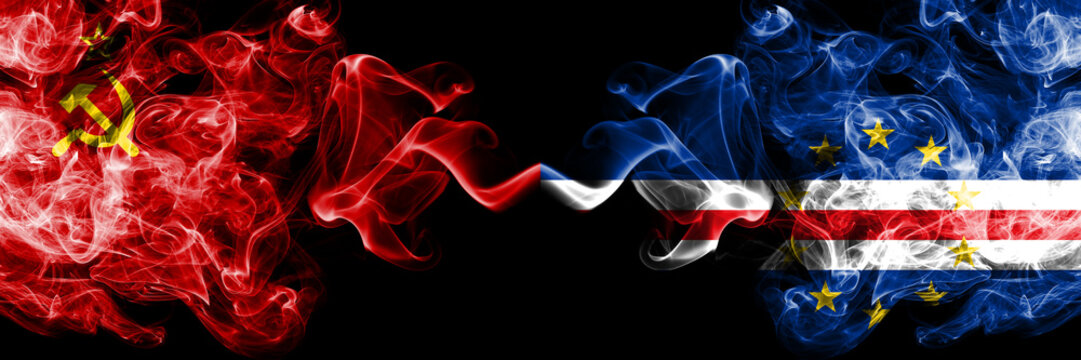 Communist vs Cape Verde abstract smoky mystic flags placed side by side. Thick colored silky smoke flags of Communism and Cape Verde