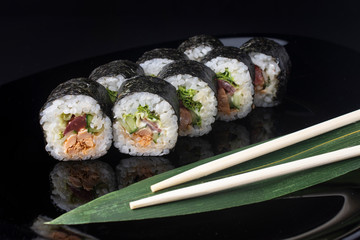 Japanese Sushi Rolls with with greens and tuna