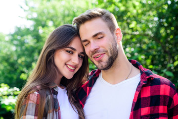 Fototapeta premium Enjoying each other. Man hipster and pretty woman in love. Summer vacation. Fall in love. Pure feelings. Romantic date concept. Cuddling with darling. Beautiful people. Happy together. Couple in love