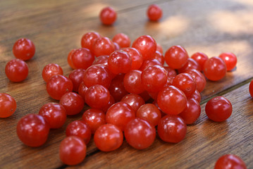 Ripe sweet cherries on a wooden table. Red berries.
