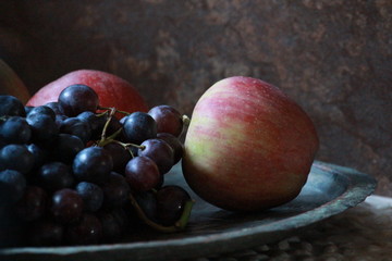 grapes and apples on table