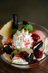 raspberry and pistachio ice cream sundae dessert in bowl