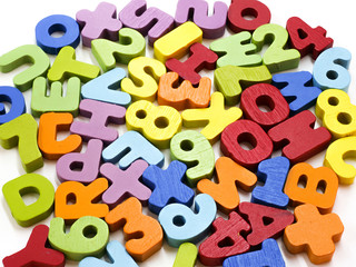 School supplies, various colored letters arranged in words.