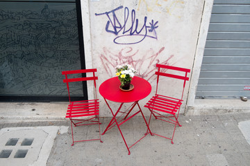 red table with two chairs