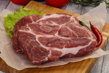 Raw pork neck steak