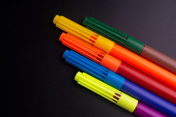 color felt-tip pens isolated on black