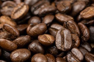 Roasted coffee beans background, Close Up mixture of different kinds of coffee beans.