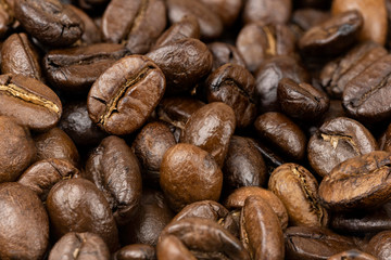 Roasted coffee beans background, Close Up mixture of different kinds of coffee beans.