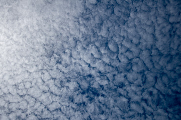 Obraz premium Unusual looking fluffy white clouds on a blue sky – symbol for climate, meteorology ant atmosphere