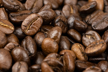 Roasted coffee beans background, Close Up mixture of different kinds of coffee beans.
