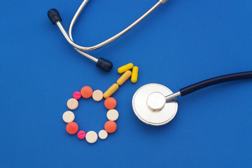 Gender men symbol icon of tablets and pills on blue background.  Concept medicine for men.