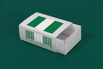 Nigeria flag on white box with barcode and the color of nation flag on green background, paper packaging for put match or products.