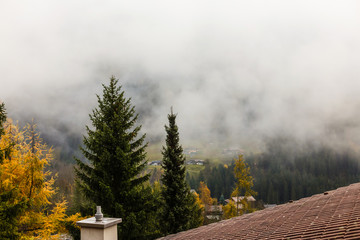 Dramatic clouds with mountain and tree, autumn