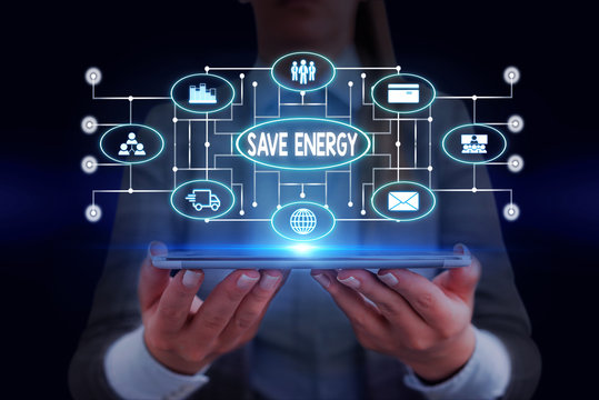 Text sign showing Save Energy. Business photo showcasing decreasing the amount of power used achieving a similar outcome Woman wear formal work suit presenting presentation using smart device