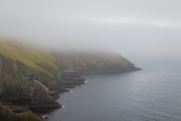 coastline in fog, cliff