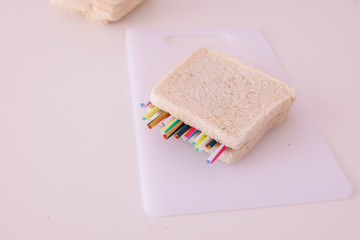 Environmental problem concept.Preparing a sandwich with some straws.