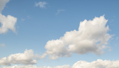Naklejka na ściany i meble Blue sky with white clouds background.