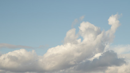 Naklejka na ściany i meble Blue sky with white clouds background.