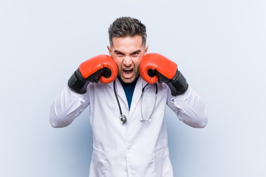 Caucasian Doctor Man Wearing Boxing Gloves