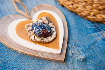 Fototapeta premium Handamde wooden heart in rustic boho style. Romantic valentine card.