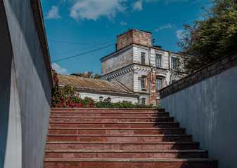 Steps leading to the garden and old building in the background