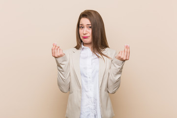 Young business woman showing that she has no money.