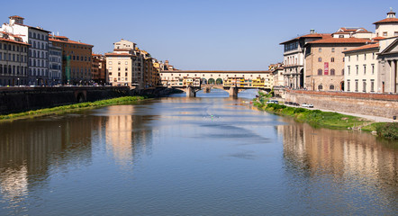 Fototapeta na wymiar Arno River and Ponte Vecchio seen from the Ponte alle Grazie