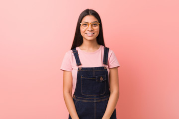 Young pretty arab woman wearing a jeans dungaree happy, smiling and cheerful.