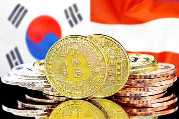 Concept for investors in cryptocurrency and Blockchain technology in the South Korea and Austria. Bitcoins on the background of the flag South Korea and Austria.