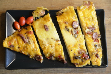 On the board is a freshly baked, hot appetizing Italian pizza.