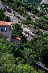 Fototapeta na wymiar Montserrat mountain and monastery near Barcelona rocks with greens on it