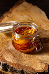 Sun-dried tomatoes with olive oil in a jar. Step by step cooking