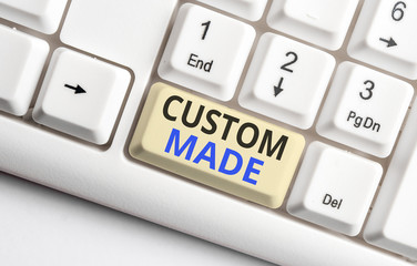 Text sign showing Custom Made. Business photo showcasing something is done to order for particular customer organization White pc keyboard with empty note paper above white background key copy space