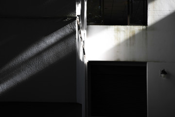 sunlight and Black shadows on the concrete building, abstract shadow, background for ideas