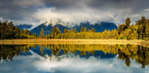 Panoramic Lake Matheson with perfect reflection at sunrise, South Island, New Zealand